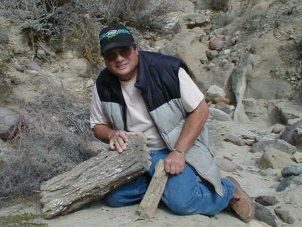 David Kier With Petrified Logs
